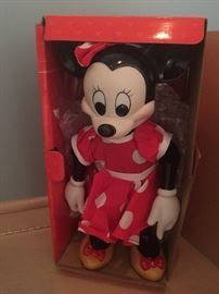 Collectible Mini Mouse has a key to wind her up.