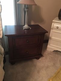 Matching bedside tables in a dark wood. Like new condition. These will go fast!