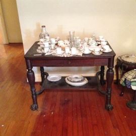 Numerous demitasse cups and saucers