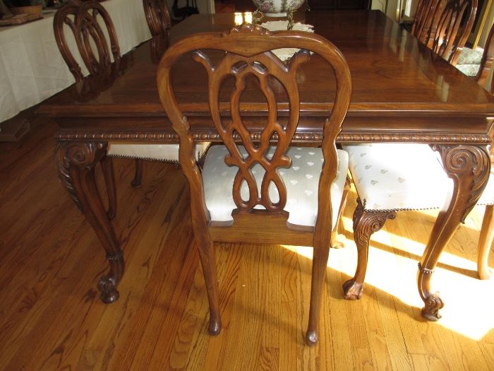 Karges original hand carved dining room table with 12 chairs, 3 leaves and pads