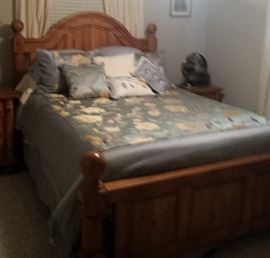 queen bedroom with comforter, dust ruffle, pillows