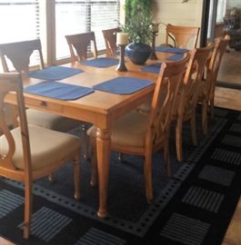 large wooden dining table/8 chairs, rug