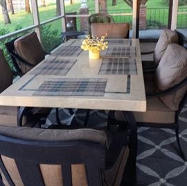 7-piece dining set with Travertine tabletop, chair with sunbrella fabric