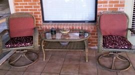 wicker chairs, table in sunroom