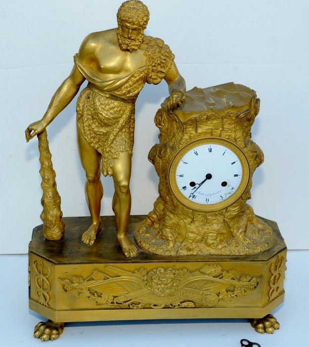 Empire French Gilt-Bronze Mantel Clock w/ Hercules.
CASED IN A CARVED, FAUX TREE TRUNK FLANKED BY HERCULES FIGURE.
FRANCE ~ LESIEUR ~ 19" h x 14 7/8" x 5 7/8" d
GLASS CLOCK FACE COVER & BACK COVER MISSING