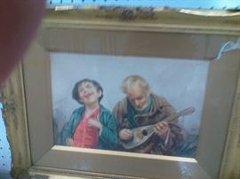 This Italian watercolor works well with the previous image by Gianni. A young boy enjoys the music an older man plays on a lute. A wonderful addition to any home. Image approx. 9 1/2" x 13 3/4", with frame 17 1/2" x 21 3/4".