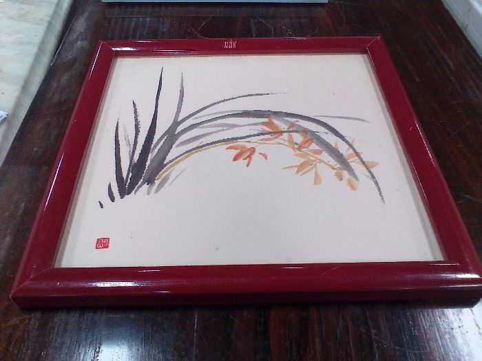 Sometimes less is more. This still life by a Japanese artist is beautiful in its simplicity and measures approx.  9-1/2" x 10". Done in shades of black and orange, it is offset with a cranberry frame.