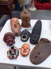 This lot of masks and carved faces is available just in time for Halloween. Some are a little small, so you may want to hang them on the wall or lay on a table.