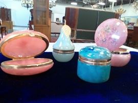 These colorful, hinged jewelry boxes are small, but still can hold a lot! A convenient and decorative place to hold your trinkets. 