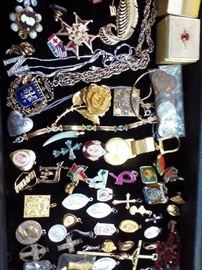 This lot includes many medals, along with chains and various pieces. If you're looking for items to put on a chain, this is the lot for you.