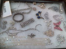 Add some sparkle to your life with this tray. Sparkles come in all colors and types of jewelry in this lot. Brighten up the coming cold weather with a sparkle and a smile.