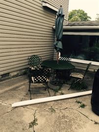 LARGE WROUGHT IRON PATIO TABLE WITH CHAIRS