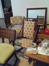 mirrors, chairs, tables all in mid-century and earlier style