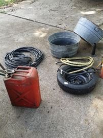 gas can, copper wire, spare tire, old wash bucket