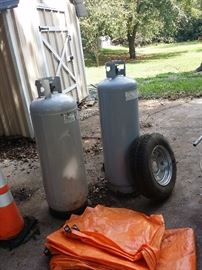 extra large L P Gas bottles, orange tarp