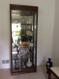 Stunning lighted display cabinet with copper accent
