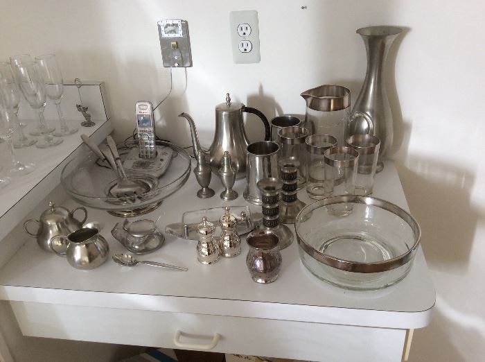 Several pewter serving pieces
