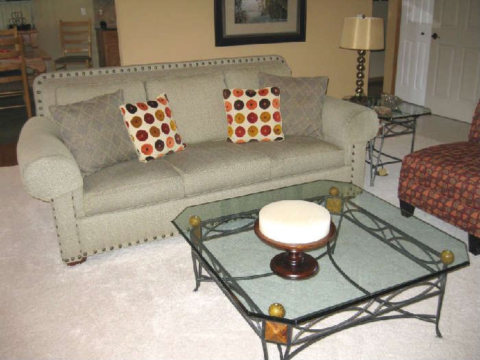 taupe sofa and glass top tables