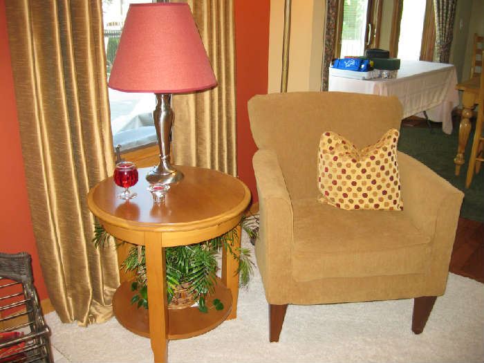 tan side chair and round table and lamp