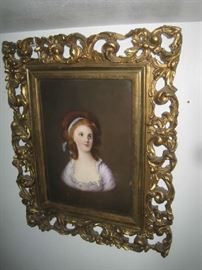 Painting on porcelain of young woman in ornate open gold frame 