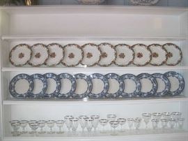 China plates- top shelf: John Maddock & Sons- England Royal Vitreous- MAJESTIC; Second shelf: TR+C MIRANDA blue/white plates; Fostoria Wedding Ring crystal- sherbets, goblets
