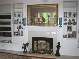 Living room wall of Nippon porcelain, mirrored fire screen, brass fender, bronzes, Imperial clock , book collections