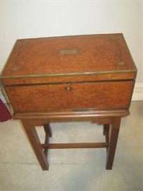 Large lap desk on table with monogramed brass plate