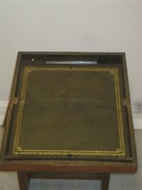 Lap desk opened with writing surface and ink bottles