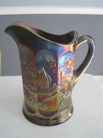 Carnival glass pitcher with bird motif