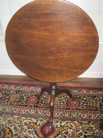 Large 28" tilt top round table with Queen Anne legs and paw feet 
