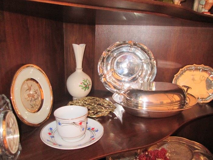 Silver plate serving pieces and a Lenox Christmas vase