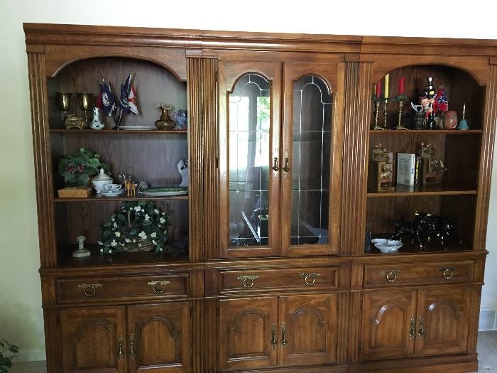 Display cabinet, three pieces.  Leaded glass doors, interior lighting.Grommets on open shelves for electronic equipment.