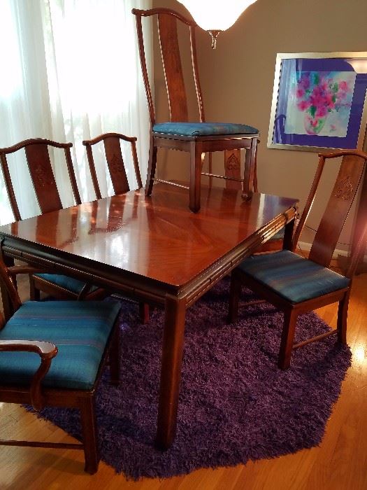 Bernhart Asian Inspired design dining set with 4 side chairs and 2 arm chairs. Comes with 2 18" leaves (not pictured). Rug and artwork are NFS.