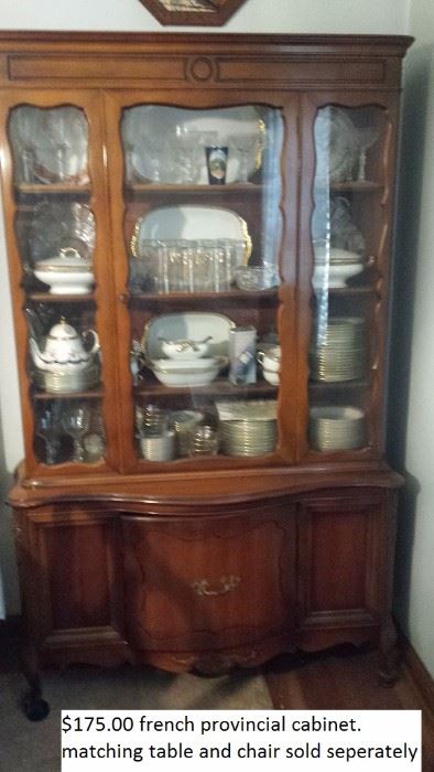 Frech provincial china cabinet. Contents of cabinet not included. Has matching table with six chairs.