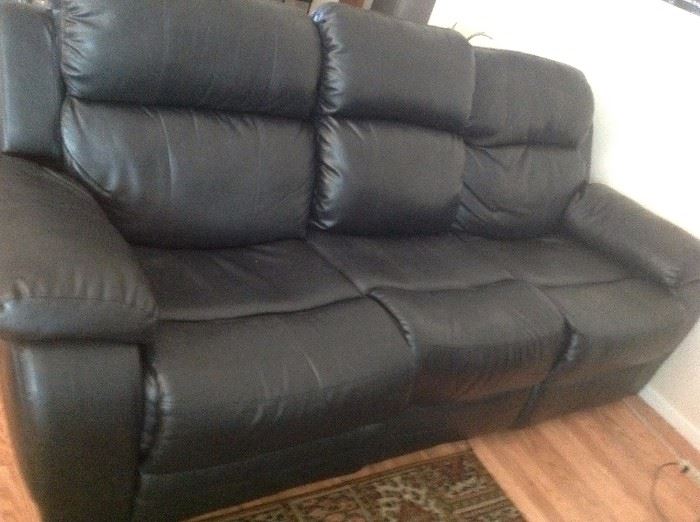 Leather Reclining Sofa with center which comes down for a quick table with cup holders
