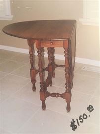 SOLD----LOT# 305  Antique Gate Leg Table,  Maplewood, Walnut Finish, with 1 small drawer.  30 1/2" H X 12 1/2" W X  32 3/4" Center (16 1/2" each side) $50.