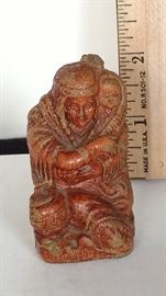 Wooden squaw with baby carved figure