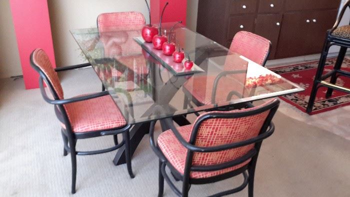 Dining table glass  seats 6. Black and red fabric chairs