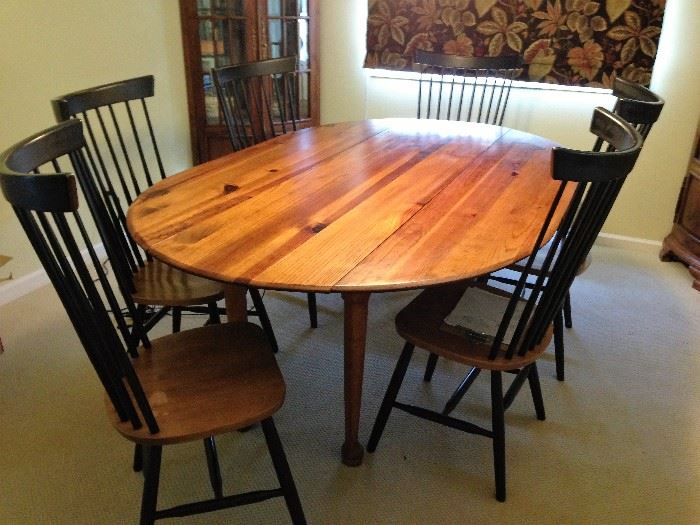 Beautiful dining table with drop leaf sides.  Six chairs