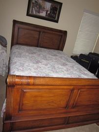 The Queen sleigh head and foot board are for sale, mattresses not included. 