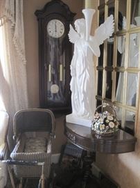 wicker doll carriage, mahogany half round stand, wall clock & large angel