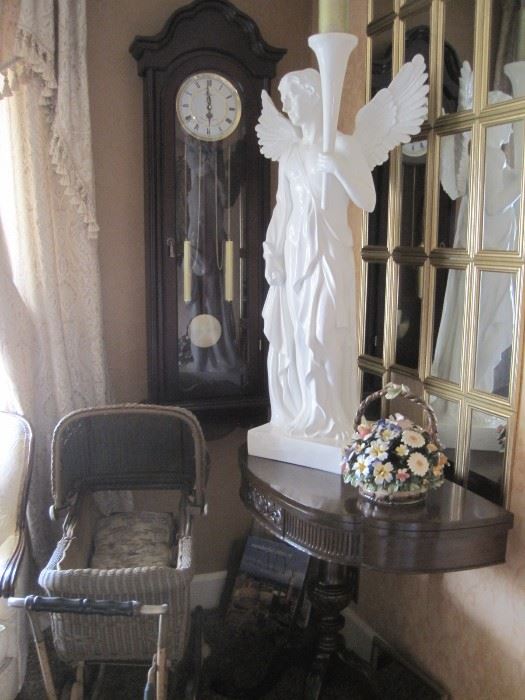 wicker doll carriage, mahogany half round stand, wall clock & large angel