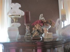 decorative items on mahogany hi-boy 