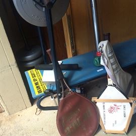 Weight bench and vintage tennis rackets 