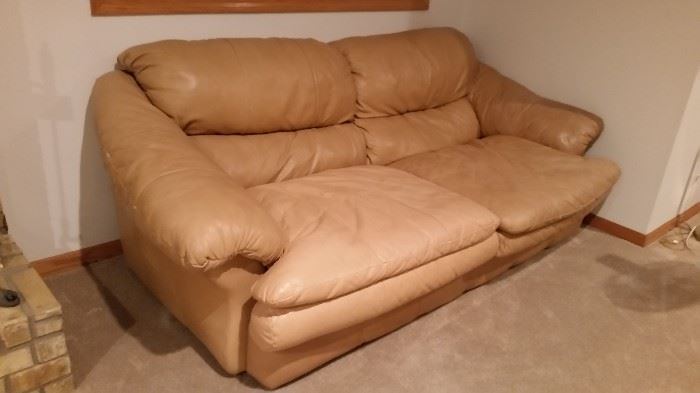 Leather sofa has matching ottoman