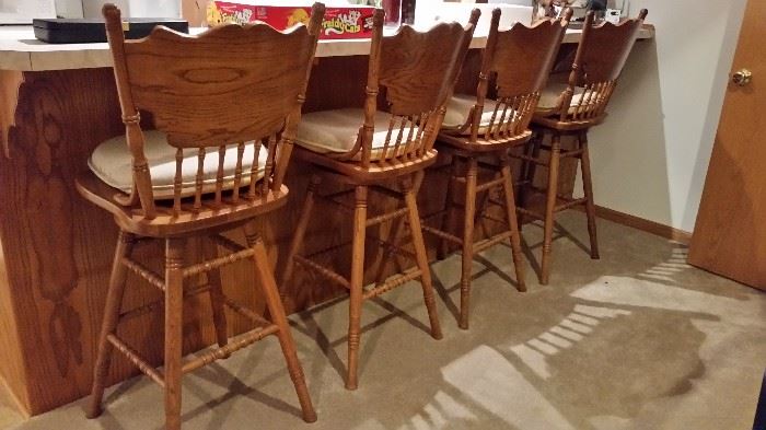 Four matching oak bar stools