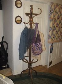 hat rack, nice clothing and purses