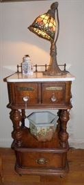 Unusual marble top apothecary style burled wood smoking table with brass galley, stained glass lamp