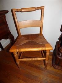 One of 2 maple side chairs with rush seats