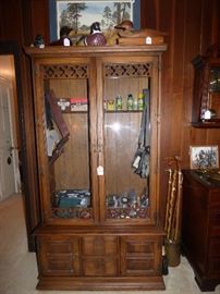 Gun cabinet with hunting items
